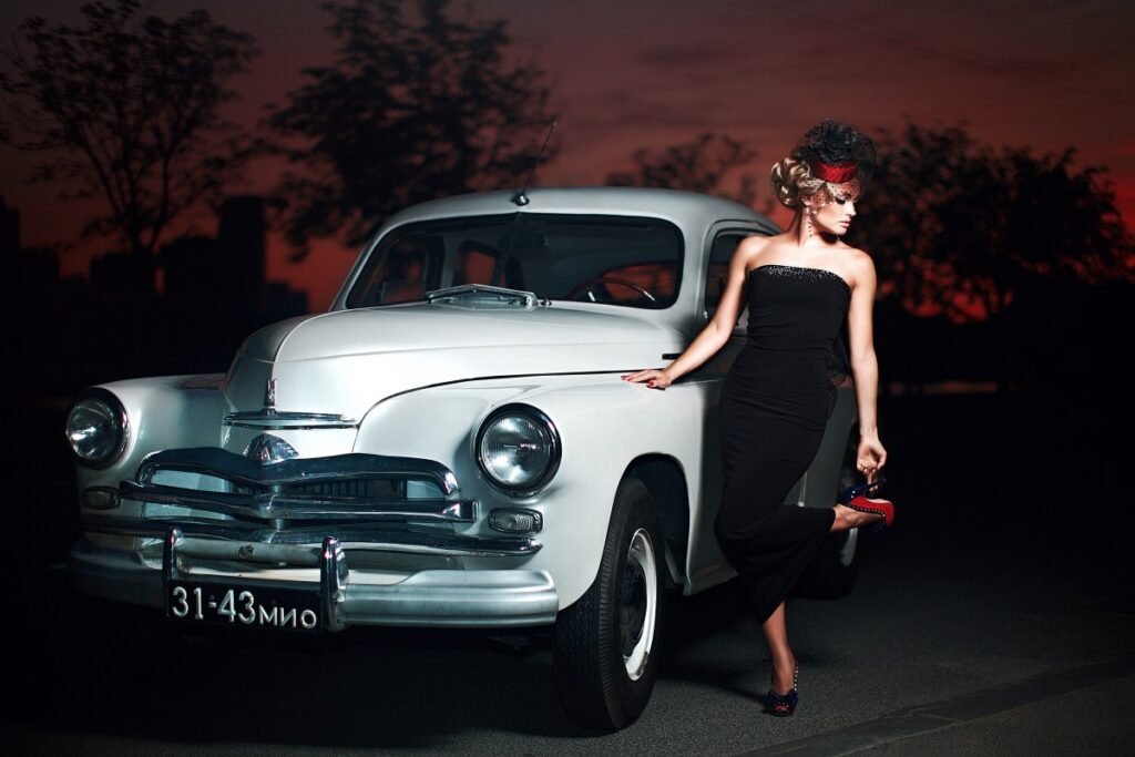 beautiful sexy fashion blond girl model with bright makeup curly hairstyle retro style sitting old car 1.jpg