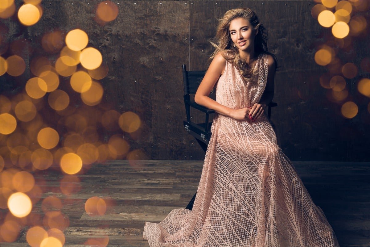 Home beautiful woman evening dress sitting chair 1.jpg