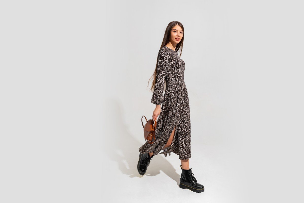 fashion model with beautiful face perfect body wearing trendy dress holding brown leather hand bag full length 1.jpg
